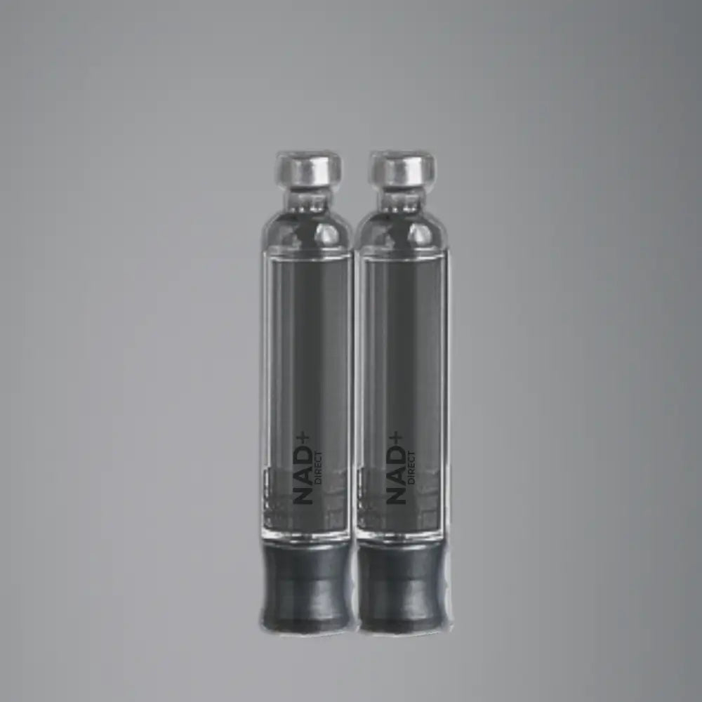 Two clear vials with silver caps on a gray background